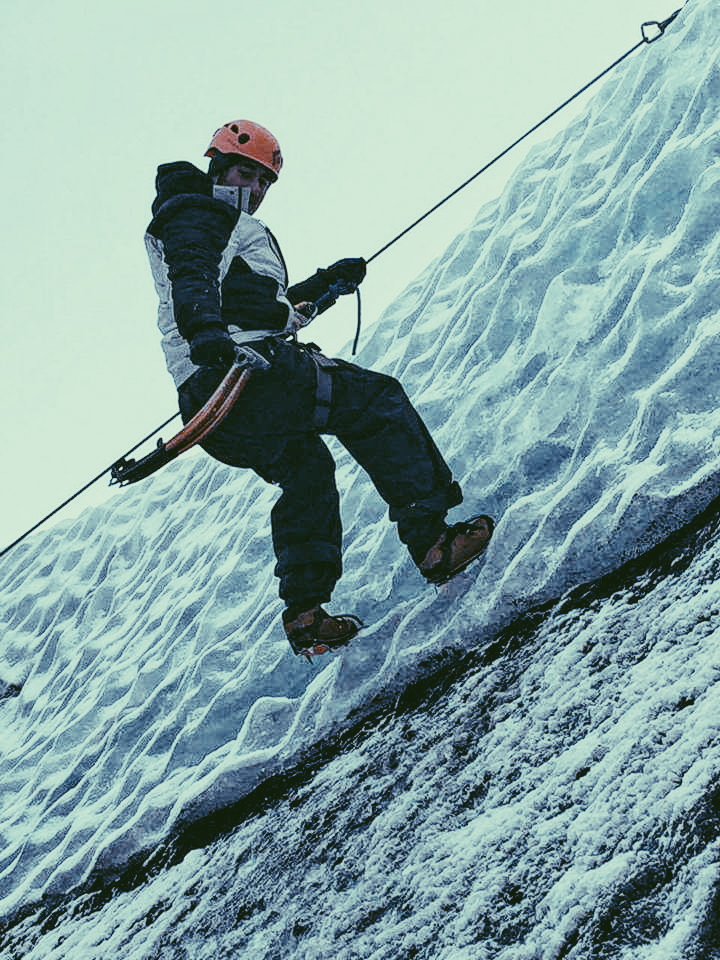 A man climbing down Solheimajokull Glacier