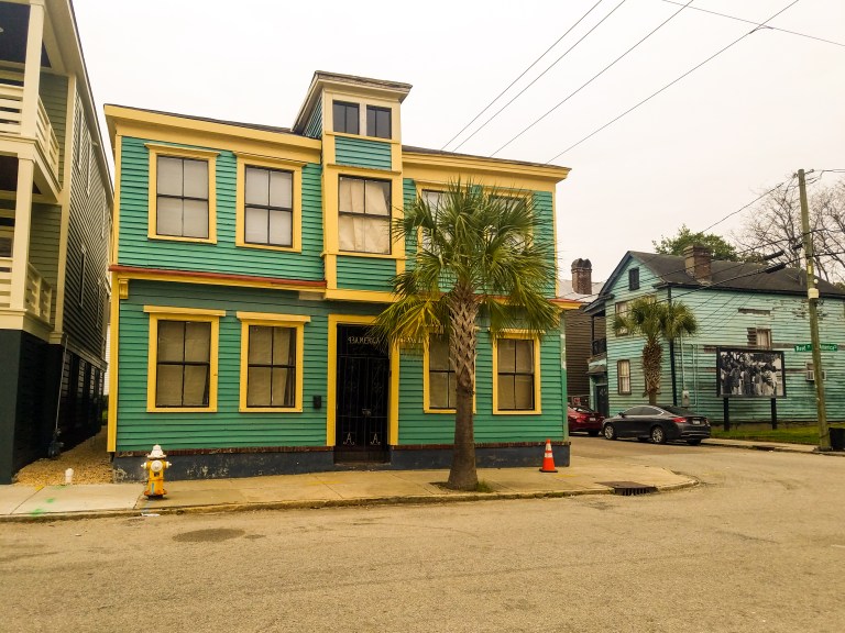 A green and yellow building in Charleston, South Carolina